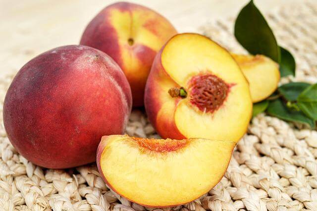 sliced peach on table